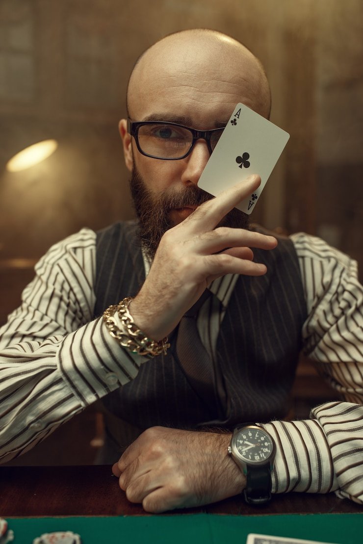 Live-dealer blackjack table displayed on mobile phone screen with dealer and cards visible